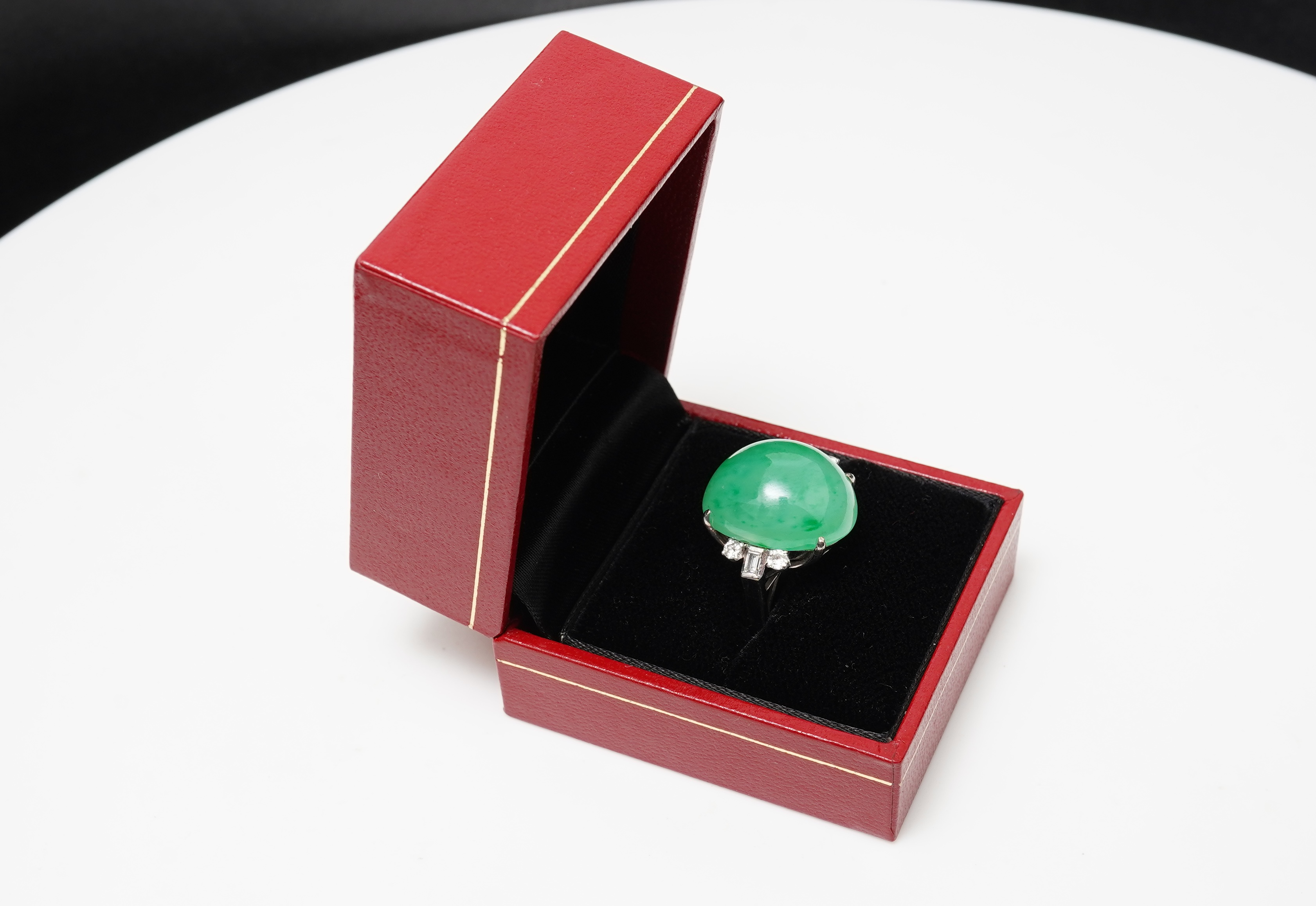 A jadeite and diamond ring